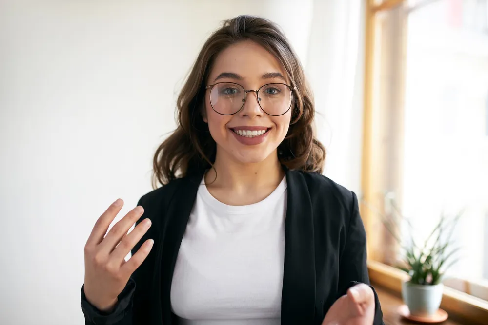 Person speaking confidently and naturally during a conversation